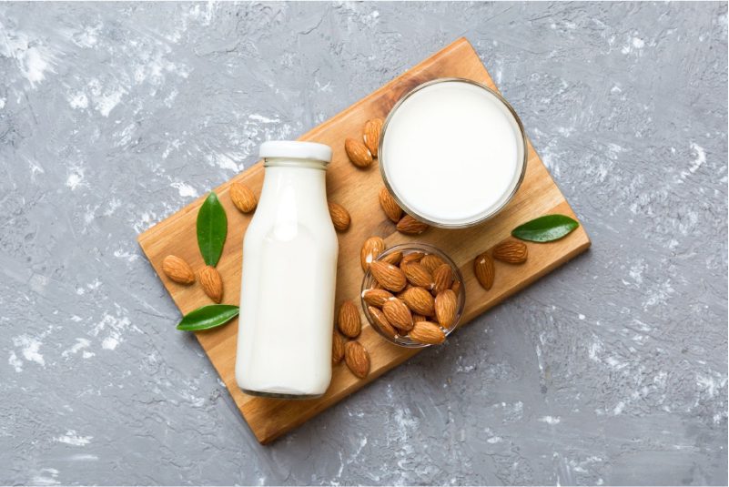 A glass of almond milk with a plant-based yogurt